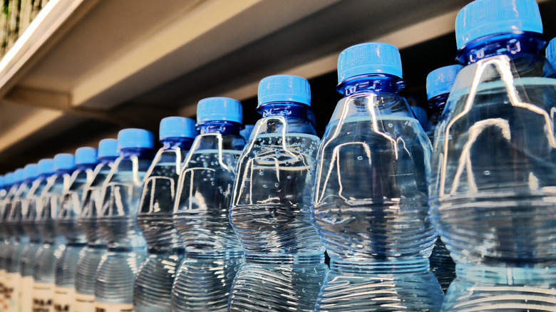 Water bottles lined in a supermarket.