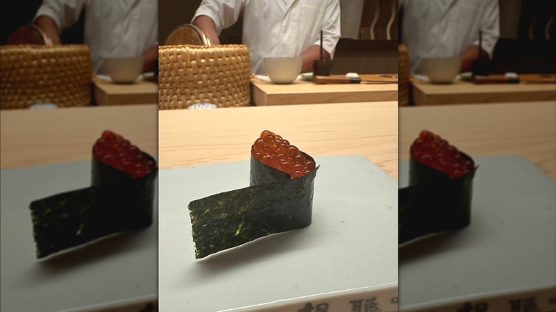 a salmon roe nigiri with open seaweed wrapper at Shingo in Miami