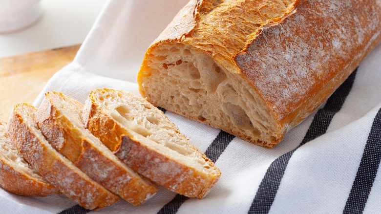 Sliced sourdough bread on a kitchen towel