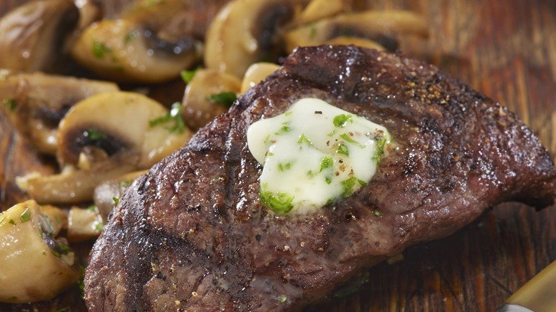 Top sirloin with butter and mushrooms