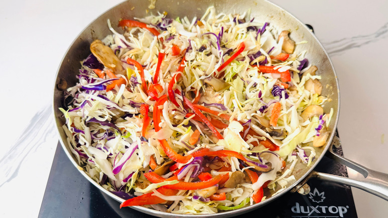 Various veggies and coleslaw in pan