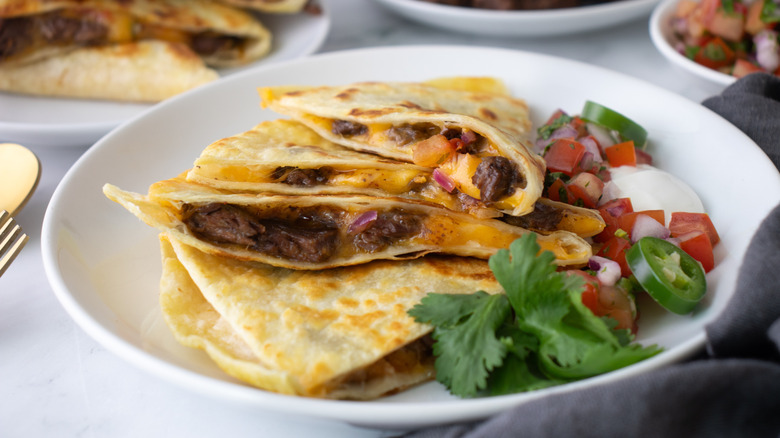 meat-filled quesadillas on a white plate