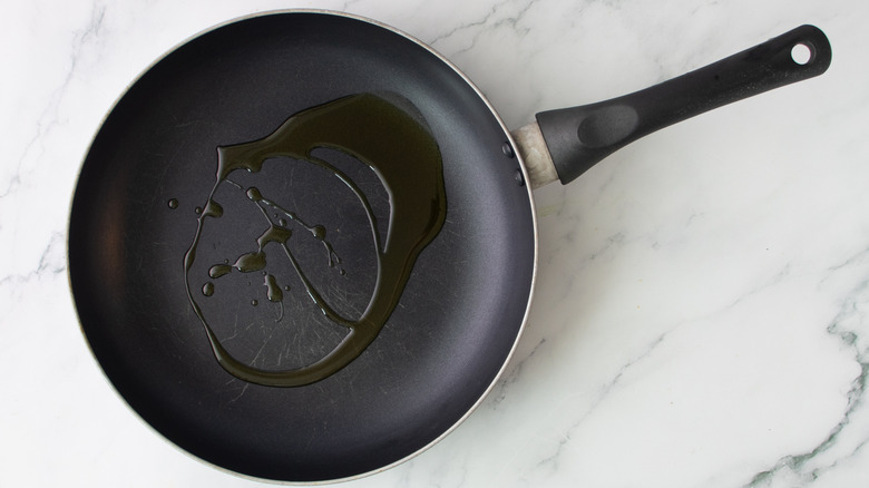 oil in a black frying pan