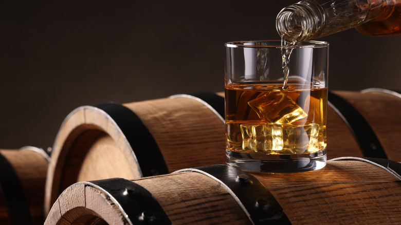 Whiskey glass on barrel