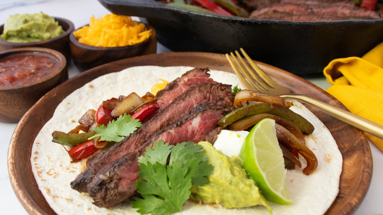 Side shot of fajitas on a plate