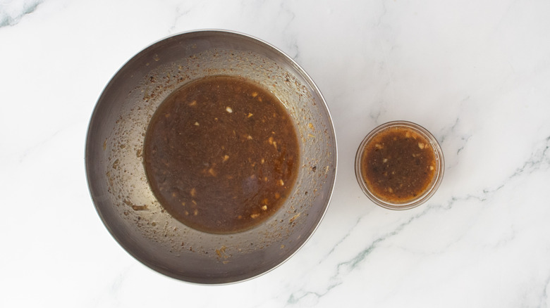 Carne asada marinade in two bowls, one portion larger than the other