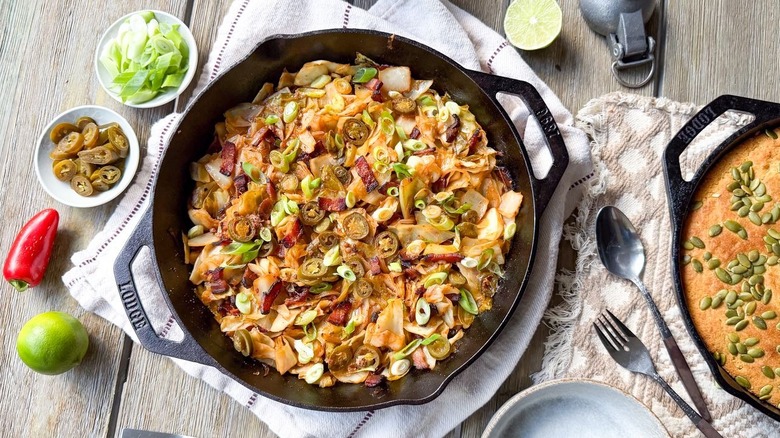 Skillet cowboy cabbage with garnishes and cornbread