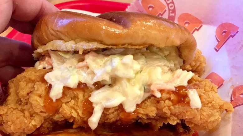 Popeyes coleslaw on a chicken sandwich