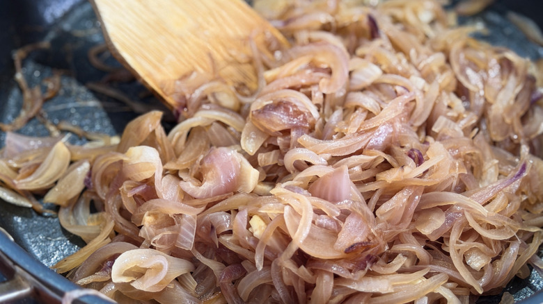 caramelized onions are stirred in a pan