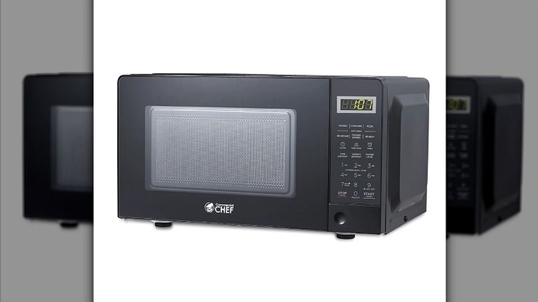 A simple black microwave with touchpad buttons