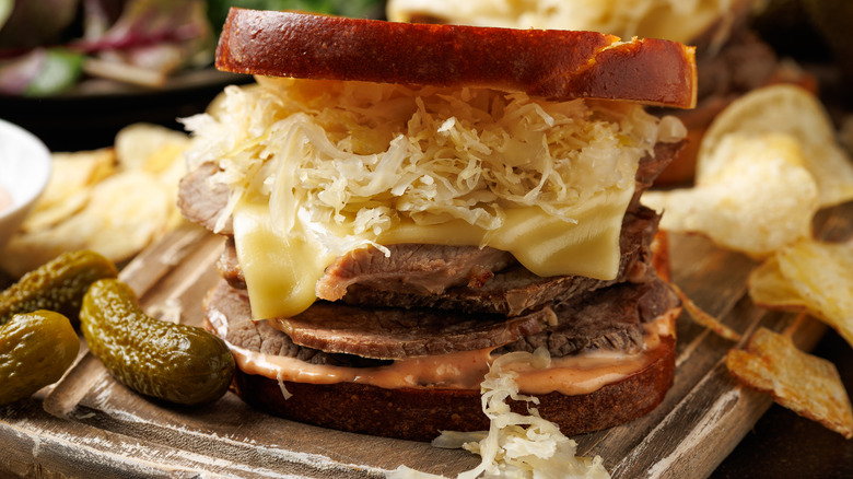 Reuben sandwich with beef, cheese, sauerkraut, and Russian dressing.