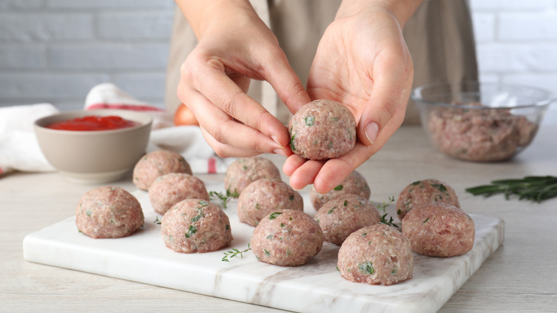 Person making meatballs