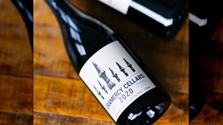 A bottle of Gramercy Cellars Syrah Lagniappe "Red Willow Vineyard" on a table