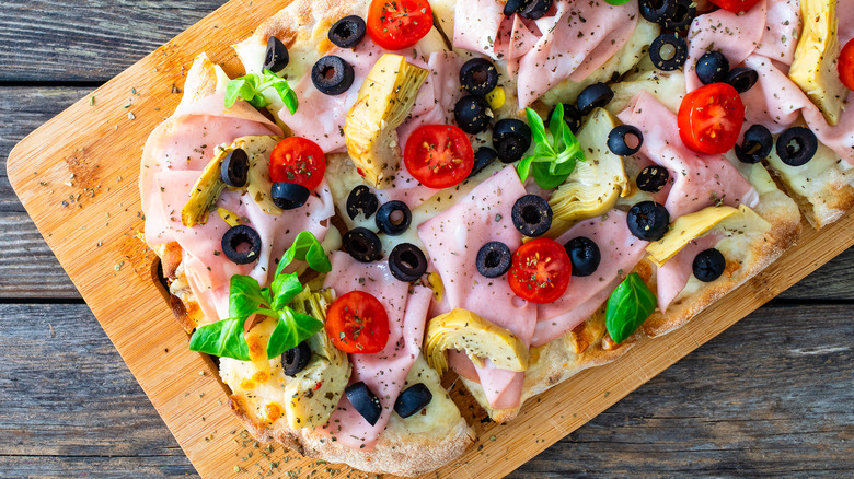Charcuterie pizza with baked and raw toppings