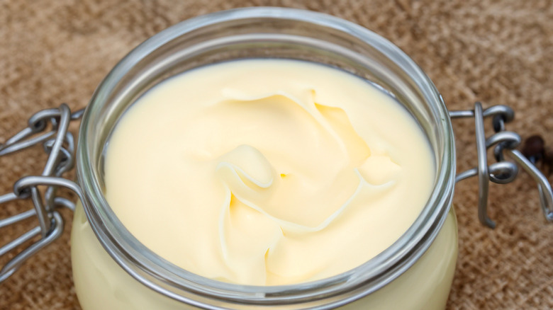 A jar of beef tallow in close-up.