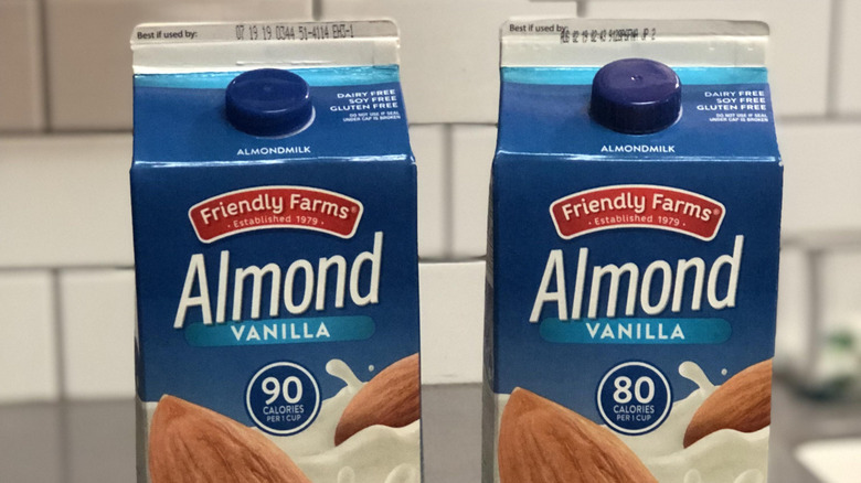 Two cartons of Aldi's Friendly Farms vanilla almond milk