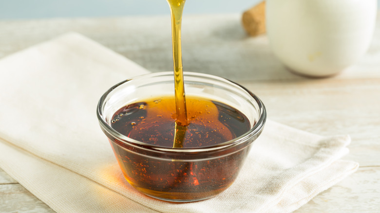dark raw agave syrup in a glass bowl