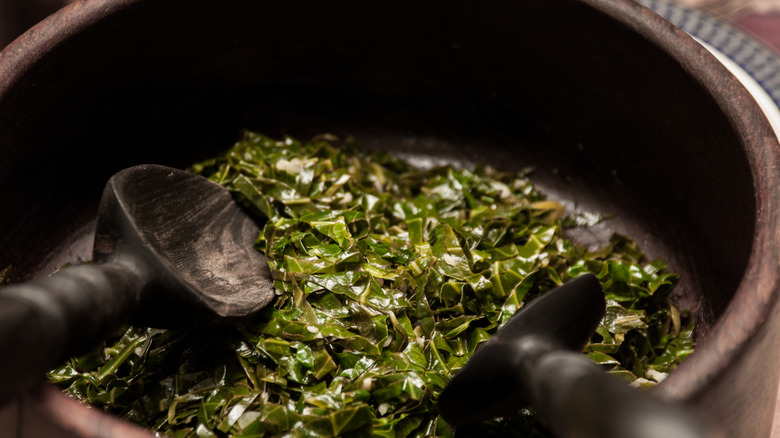 Bowl of collard greens with spoons