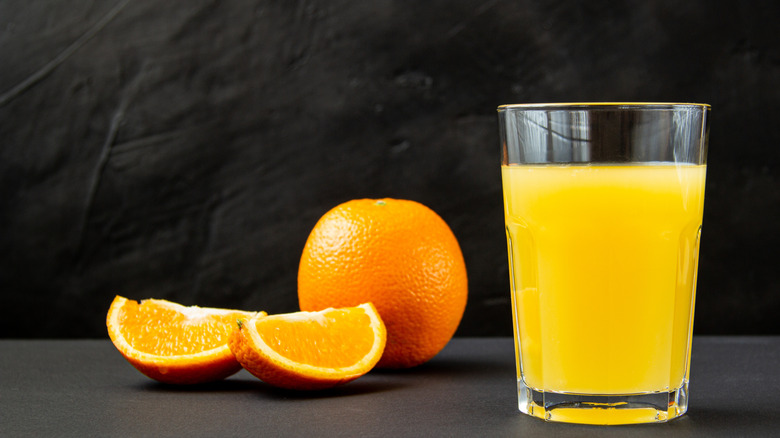 Glass of orange juice with orange slices