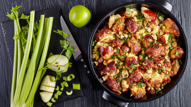 Celery and apples next to a pan of stuffing