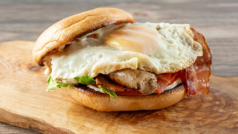 A sandwich with a fried egg and bacon.