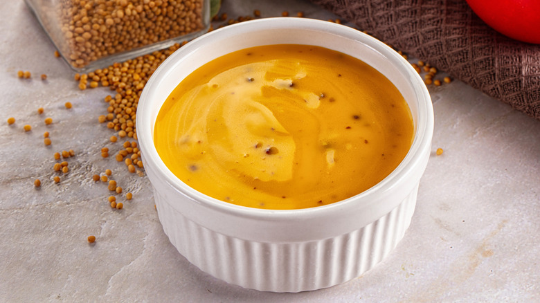 Honey mustard dip in a white ramekin.