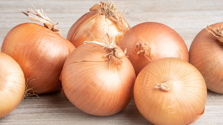 A group of fresh onions on a tabletop