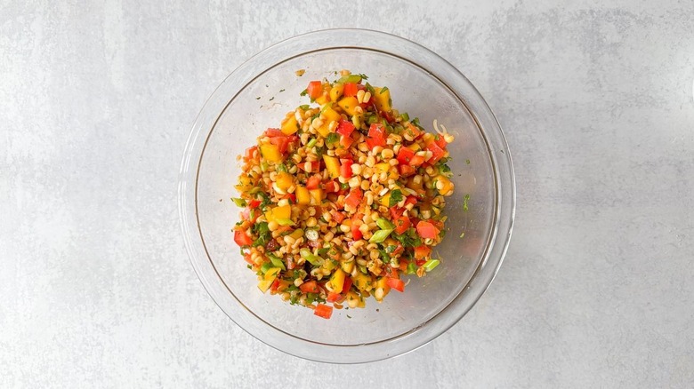 Mango-corn salsa in glass bowl