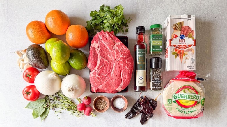 Slow cooker barbacoa tacos ingredients on countertop
