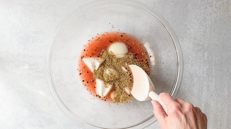 Barbacoa beef taco marinade ingredients in glass bowl