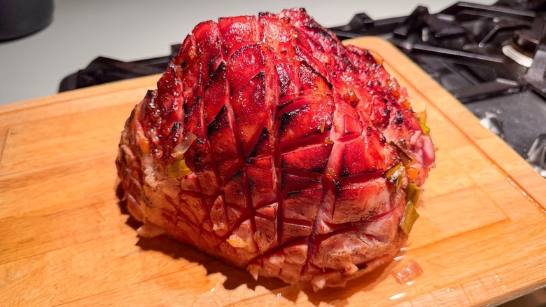 Slow cooker Easter ham with apricot and Kahlua resting on cutting board