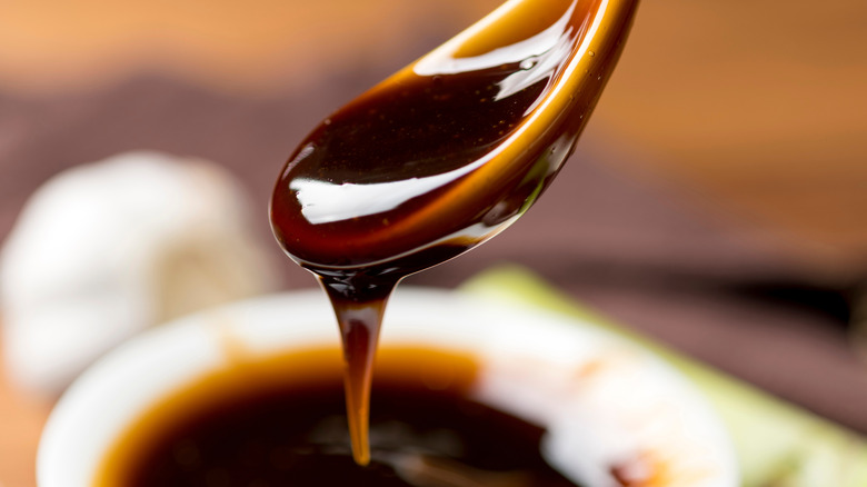 Fresh seasoning oyster sauce spoon filled oyster sauce close up