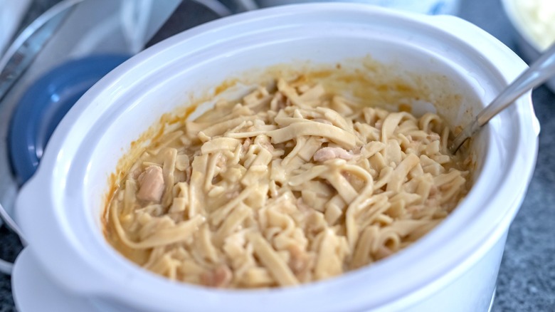Crock pot filled with creamy pasta