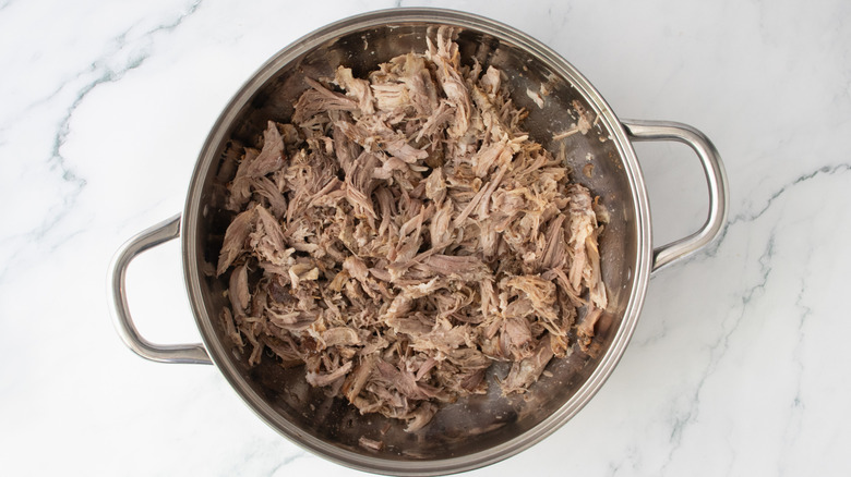 Pulled pork in a large shallow pot
