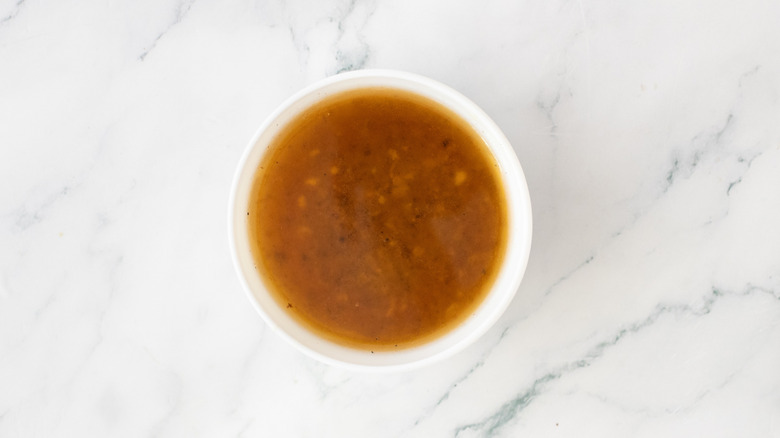 Small bowl of reserved pan drippings