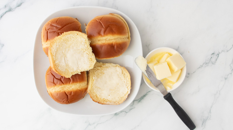 Brioche rolls brushed with softened butter