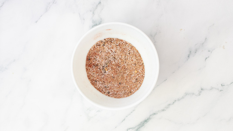 Spice blend rub in a small white bowl