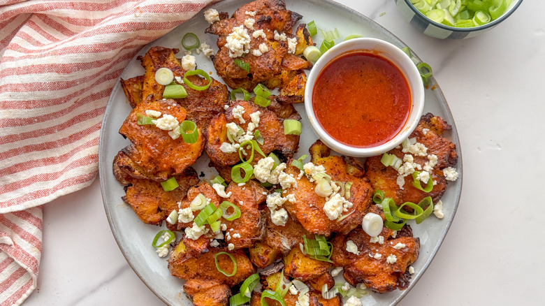 smashed potatoes on plate