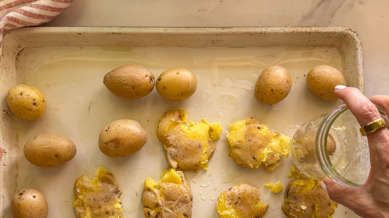 hand smashing potatoes