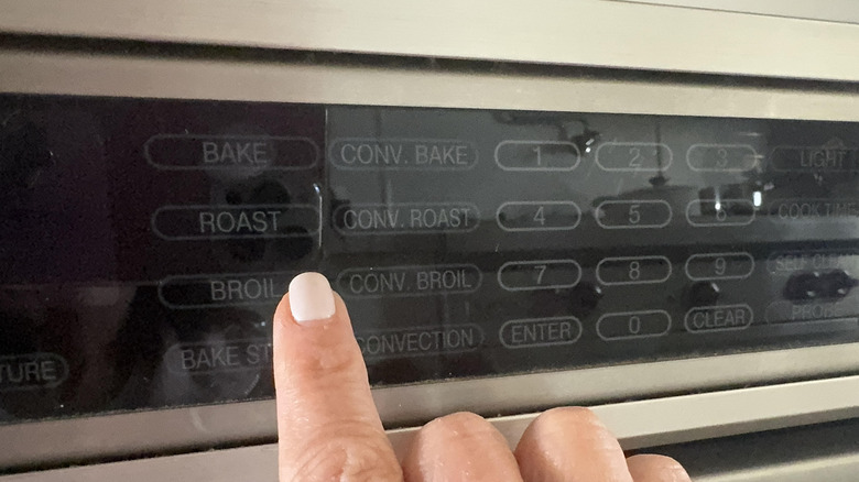 finger setting oven to broil