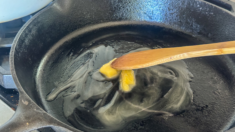 wooden spoon stirring butter