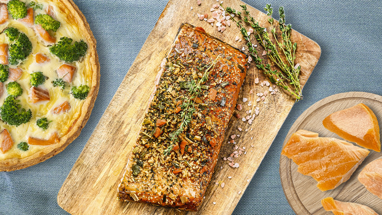 arrangement of smoked salmon dishes on fabric background