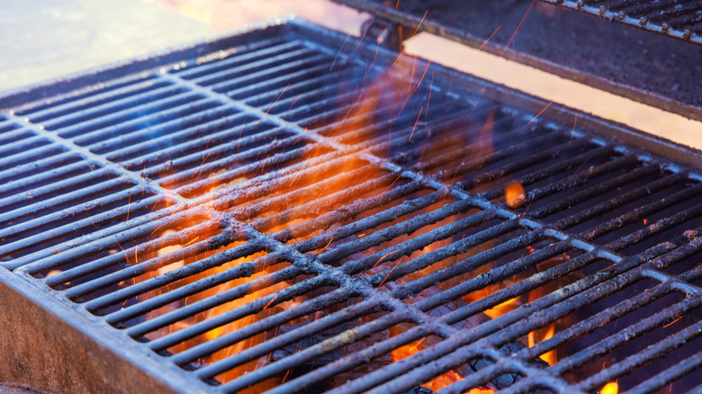 smoky grill with flaming woodchips