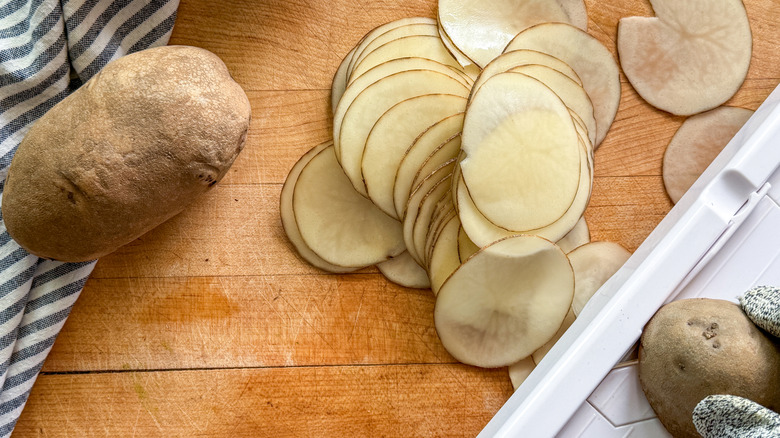 potato slices next to mandoline