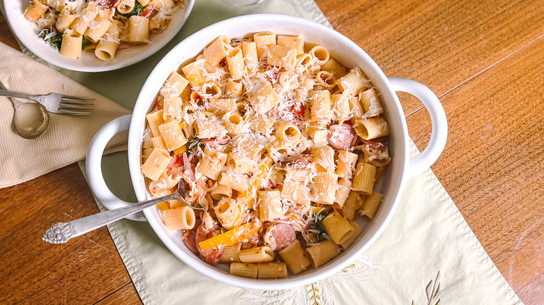 Smoky mustardy kielbasa pasta in serving dish on table