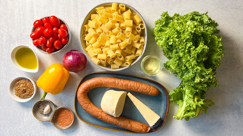 Smoky mustardy kielbasa pasta ingredients on countertop