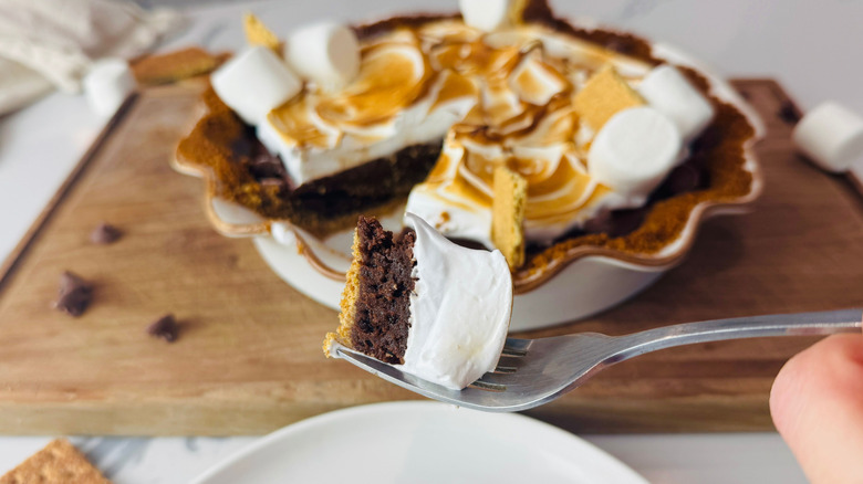 S'mores pie with forkful of pie in front of it