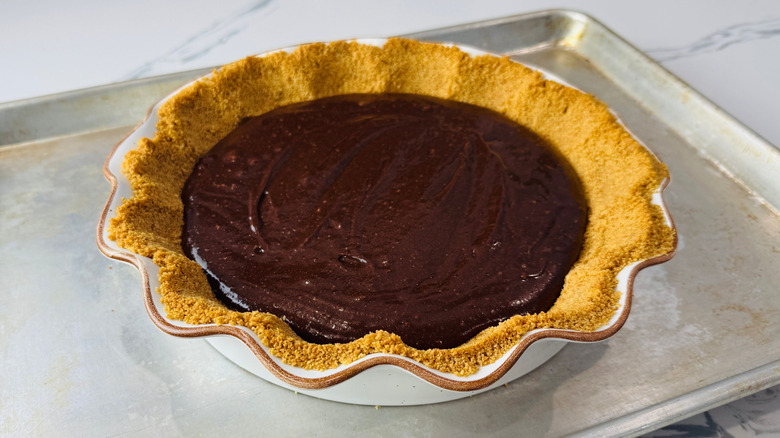 Unbaked brownie pie on baking sheet