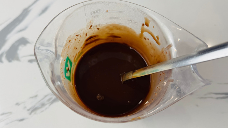 Melted chocolate in measuring cup