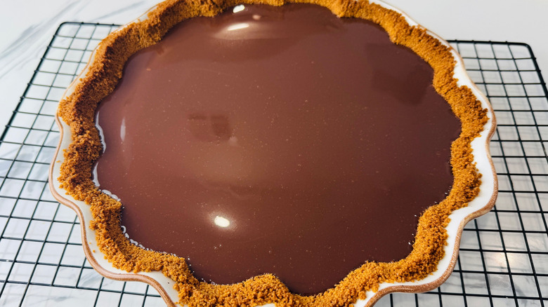 Chocolate pie on wire rack